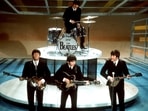 FILE -The Beatles, foreground from left, Paul McCartney, George Harrison, John Lennon and Ringo Starr on drums perform on the CBS "Ed Sullivan Show" in New York on  Feb. 9, 1964. Sixty years after the onset of Beatlemania and with two of the quartet now dead, artificial intelligence has enabled the release of a “new” Beatles song.“Now And Then,” will be available Thursday, Nov. 2. 