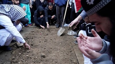 Muslim community members mourn Wadea Al Fayoume at his grave in LaGrange, Ill., Monday, Oct. 16, 2023. An Illinois landlord accused of fatally stabbing the 6-year-old Muslim boy and seriously wounding his mother was charged with a hate crime after police and relatives said he singled out the victims because of their faith and as a response to the war between Israel and Hamas. (AP Photo/Nam Y. Huh) (AP) Muslim community members mourn Wadea Al Fayoume at his grave in LaGrange, Ill., Monday, Oct. 16, 2023. An Illinois landlord accused of fatally stabbing the 6-year-old Muslim boy and seriously wounding his mother was charged with a hate crime after police and relatives said he singled out the victims because of their faith and as a response to the war between Israel and Hamas. (AP Photo/Nam Y. Huh) (AP)