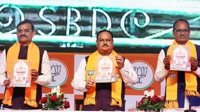 BJP president JP Nadda with Madhya Pradesh chief minister Shivraj Singh Chouhan and party state chief VD Sharma releases the party’s manifesto for the state assembly elections in Bhopal on Saturday. (ANI) BJP president JP Nadda with Madhya Pradesh chief minister Shivraj Singh Chouhan and party state chief VD Sharma releases the party’s manifesto for the state assembly elections in Bhopal on Saturday. (ANI)