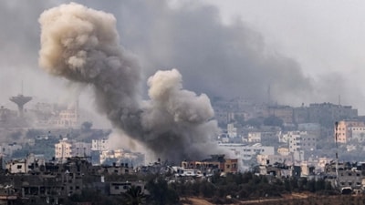 Smoke rising over buildings during an Israeli strike on the Gaza Strip enclave. (AFP) Smoke rising over buildings during an Israeli strike on the Gaza Strip enclave. (AFP)