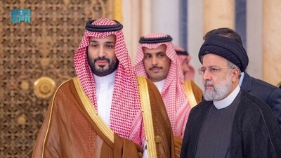 Saudi Crown Prince Mohammed bin Salman meets Iranian President Ebrahim Raisi during the Organisation of Islamic Cooperation (OIC) summit in Riyadh on November 11. (Reuters)