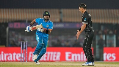 Virat Kohli (L) and Trent Boult during India's match against New Zealand during 2023 World Cup's group stage (AP)