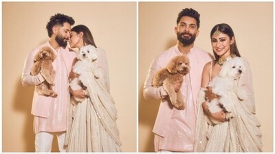 Mouni Roy and her husband Suraj Nambiar donned traditional attire as they posed alongside their pet dogs for Diwali. Mouni shared the photos on her Instagram handle with the caption, "Diwali nights #me&mine." (Instagram/@imouniroy) Mouni Roy and her husband Suraj Nambiar donned traditional attire as they posed alongside their pet dogs for Diwali. Mouni shared the photos on her Instagram handle with the caption, "Diwali nights #me&mine." (Instagram/@imouniroy)