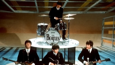 FILE -The Beatles, foreground from left, Paul McCartney, George Harrison, John Lennon and Ringo Starr on drums perform on the CBS "Ed Sullivan Show" in New York on Feb. 9, 1964. Sixty years after the onset of Beatlemania and with two of the quartet now dead, artificial intelligence has enabled the release of a “new” Beatles song.“Now And Then,” will be available Thursday, Nov. 2. (AP) FILE -The Beatles, foreground from left, Paul McCartney, George Harrison, John Lennon and Ringo Starr on drums perform on the CBS "Ed Sullivan Show" in New York on Feb. 9, 1964. Sixty years after the onset of Beatlemania and with two of the quartet now dead, artificial intelligence has enabled the release of a “new” Beatles song.“Now And Then,” will be available Thursday, Nov. 2. (AP)
