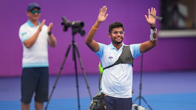 India's Dhiraj Bommadevara competes against Kazakhstan's Abdullin Ilfat in the quarterfinal match of men's recurve individual archery event at the 19th Asian Games, in Hangzhou, China (PTI) India's Dhiraj Bommadevara competes against Kazakhstan's Abdullin Ilfat in the quarterfinal match of men's recurve individual archery event at the 19th Asian Games, in Hangzhou, China (PTI)