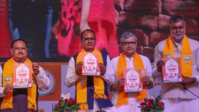 BJP National President JP Nadda with Madhya Pradesh Chief Minister Shivraj Singh Chouban and others releases election manifesto ahead of the state assembly elections, in Bhopal on November 11. (PTI) BJP National President JP Nadda with Madhya Pradesh Chief Minister Shivraj Singh Chouban and others releases election manifesto ahead of the state assembly elections, in Bhopal on November 11. (PTI)
