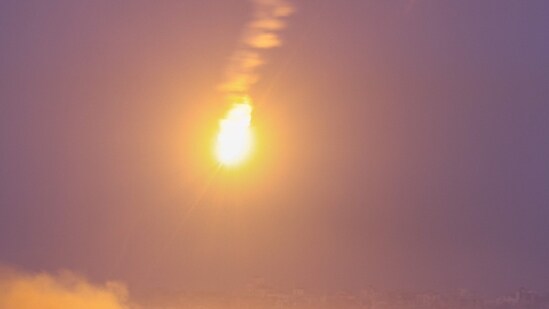 This picture taken from the Israeli side of the border with the Gaza Strip, shows flares being fired by Israeli troops over the Gaza Strip during Israeli bombardment. (AFP)