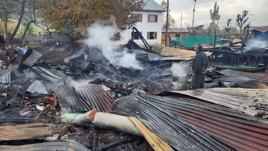 The fire began in one of the houseboats on Friday late at night and quickly spread and engulfed several others.&nbsp;(HT Photo/Waseem Andrabi)