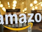 FILE PHOTO: FILE PHOTO: The logo of Amazon is seen on the door of an Amazon Books retail store in New York City, U.S., February 14, 2019. REUTERS/Brendan McDermid/File Photo/File Photo)