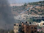 Palestinians clash with Israeli soldiers after Jewish settlers stormed the Palestinian West Bank village of Dayr Sharaf.