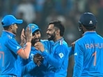 India's Virat Kohli (2R) celebrates with Shubman Gill (L), captain Rohit Sharma (2L) and KL Rahul after taking the wicket of Netherlands' captain Scott Edwards. India's Virat Kohli (2R) celebrates with Shubman Gill (L), captain Rohit Sharma (2L) and KL Rahul after taking the wicket of Netherlands' captain Scott Edwards.