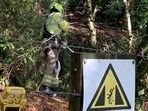 Rescue team retrieving a cat trapped in a mineshaft. 