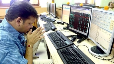 A stock trader prays in front of his trading terminal before Muhurat Trading (AFP/ File) A stock trader prays in front of his trading terminal before Muhurat Trading (AFP/ File)