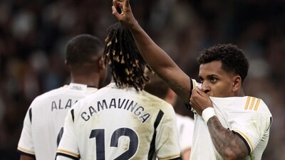 Real Madrid's Brazilian forward #11 Rodrygo (R) celebrates scoring his team's fifth goal during the Spanish league football match between Real Madrid CF and Valencia CF (AFP) Real Madrid's Brazilian forward #11 Rodrygo (R) celebrates scoring his team's fifth goal during the Spanish league football match between Real Madrid CF and Valencia CF (AFP)