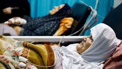 Palestinians wounded in Israeli strikes amid the ongoing conflict between Israel and Palestinian group Hamas lie at Nasser hospital to receive treatment, in Khan Younis in the southern Gaza Strip November 12. (REUTERS)