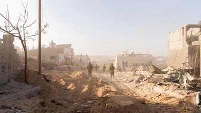 Israeli soldiers take position, amid the ongoing ground operation of the Israeli army against Palestinian Islamist group Hamas, in the Gaza Strip. (via REUTERS)