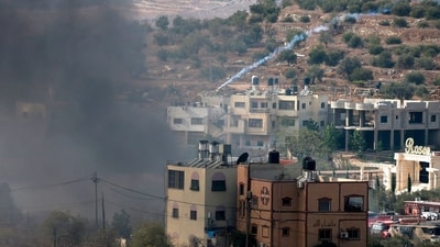 Palestinians clash with Israeli soldiers after Jewish settlers stormed the Palestinian West Bank village of Dayr Sharaf. (AFP) Palestinians clash with Israeli soldiers after Jewish settlers stormed the Palestinian West Bank village of Dayr Sharaf. (AFP)