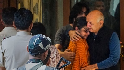Former Delhi deputy chief minister Manisha Sisodia hugs his ailing wife as he leaves for jail after spending some time at his home, in New Delhi, on November 11. (PTI) Former Delhi deputy chief minister Manisha Sisodia hugs his ailing wife as he leaves for jail after spending some time at his home, in New Delhi, on November 11. (PTI)