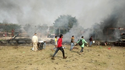 Locals at the site after a fire broke out at a shop and spread to six others in Gopalbagh on the outskirts of Mathura city on Nov 12. (PTI) Locals at the site after a fire broke out at a shop and spread to six others in Gopalbagh on the outskirts of Mathura city on Nov 12. (PTI)