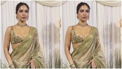 Bhumi Pednekar looked ravishing in a golden saree with golden zari details at the borders. She teamed it with a matching golden blouse with silver mirror work.&nbsp; (HT Photos/Varinder Chawla)