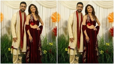 The hosts looked stunning together. Shilpa Shetty and Raj Kundra posed together. Shilpa opted for a maroon velvet lehenga with silver embellishments, while Raj complemented her in a golden sherwani with a red dupatta.&nbsp; (Instagram/@pallav_paliwal)
