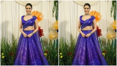 Shraddha Kapoor looked gorgeous in a blue metallic lehenga as she posed for the pictures sporting her brightest smile. In a sleek silver neck choker, she accessorised her look.&nbsp; (Instagram/@pallav_paliwal)