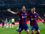 Barcelona's Robert Lewandowski celebrates scoring his side's second goal during the Spanish La Liga soccer match between Barcelona and Alaves at the Montjuic stadium 