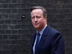 Former British Prime Minister David Cameron walks outside 10 Downing Street in London, Britain.