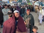Afghans wait for clearance to depart for their homeland at a deportation camp set up by authorities to facilitate illegal immigrants,