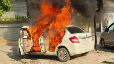 A parked catching fire at Ishmeet Chowk, Ludhiana. (HT Photo) A parked catching fire at Ishmeet Chowk, Ludhiana. (HT Photo)