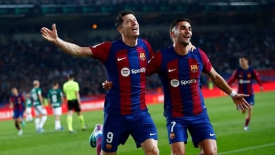 Barcelona's Robert Lewandowski celebrates scoring his side's second goal during the Spanish La Liga soccer match between Barcelona and Alaves at the Montjuic stadium (AP) Barcelona's Robert Lewandowski celebrates scoring his side's second goal during the Spanish La Liga soccer match between Barcelona and Alaves at the Montjuic stadium (AP)