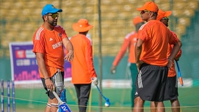 India's captain Rohit Sharma, left, speaks to head coach Rahul Dravid during a practice session (AP)