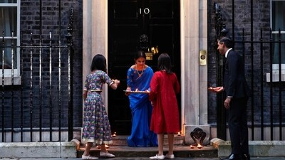 Britain's Prime Minister Rishi Sunak, his wife Akshata Murty and their daughters lay diyas outside 10 Downing Street for the celebrations to mark Diwali. (AFP) Britain's Prime Minister Rishi Sunak, his wife Akshata Murty and their daughters lay diyas outside 10 Downing Street for the celebrations to mark Diwali. (AFP)