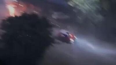 The car drove through fire and smoke moments after the firecracker was lit up. (Videograb) The car drove through fire and smoke moments after the firecracker was lit up. (Videograb)