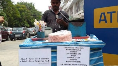 Snapshot of the peanut seller with his stall. (X/@vishnubogi)