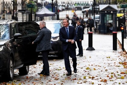Former British Prime Minister David Cameron walks outside 10 Downing Street in London on November 13. (Reuters)