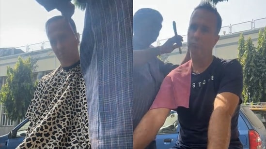 England cricketer Michael Vaughan getting a haircut from a roadside barber in Mumbai. (X/@MichaelVaughan)