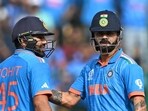 India's Virat Kohli (R) pats captain Rohit Sharma on scoring a half-century (50 runs) during the 2023 ICC Men's Cricket World Cup one-day international (ODI) match between India and Netherlands at the M. Chinnaswamy Stadium India's Virat Kohli (R) pats captain Rohit Sharma on scoring a half-century (50 runs) during the 2023 ICC Men's Cricket World Cup one-day international (ODI) match between India and Netherlands at the M. Chinnaswamy Stadium