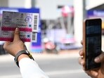 A person shows two ICC World Cup tickets of India and South Africa in front of Eden Garden in Kolkata