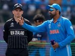 New Zealand's stand-in captain Tom Latham, left, watches as India's captain Rohit Sharma spins the coin at the toss 