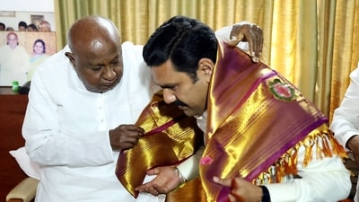 Janata Dal (Secular) chief HD Deve Gowda felicitates the newly appointed Karnataka Bharatiya Janata Party (BJP) President Vijayendra Yediyurappa during a meeting in Bengaluru. (ANI Photo) (Arunkumar Rao) Janata Dal (Secular) chief HD Deve Gowda felicitates the newly appointed Karnataka Bharatiya Janata Party (BJP) President Vijayendra Yediyurappa during a meeting in Bengaluru. (ANI Photo) (Arunkumar Rao)