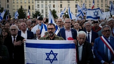 Israel-Hamas War: People hold and wave Israeli flags as they gather gather during a demonstration in a show of support for Israel in Lyon, central France. (AP)
