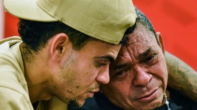 A picture released by the Colombian Football Federation (FCF) of Colombia's striker Luis Diaz (L) hugging his father Luis Manuel Diaz (R) during their meeting (AFP) A picture released by the Colombian Football Federation (FCF) of Colombia's striker Luis Diaz (L) hugging his father Luis Manuel Diaz (R) during their meeting (AFP)