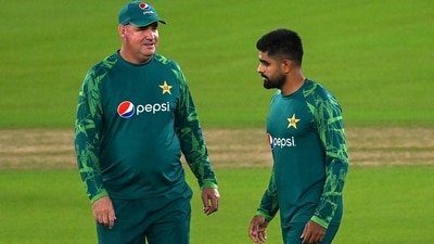 Pakistan's captain Babar Azam (R) and TD Mickey Arthur speak during a practice session (AFP) Pakistan's captain Babar Azam (R) and TD Mickey Arthur speak during a practice session (AFP)