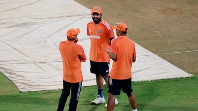 India's Rohit Sharma with head coach Rahul Dravid during practice (REUTERS)