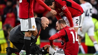 Manchester United's Danish midfielder #14 Christian Eriksen receives medical attention during the English Premier League football match vs Luton Town (AFP) Manchester United's Danish midfielder #14 Christian Eriksen receives medical attention during the English Premier League football match vs Luton Town (AFP)