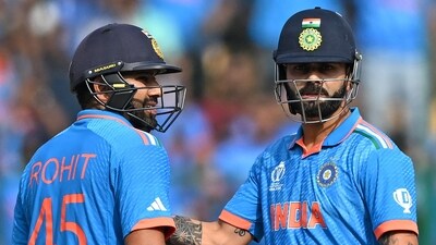 India's Virat Kohli (R) pats captain Rohit Sharma on scoring a half-century (50 runs) during the 2023 ICC Men's Cricket World Cup one-day international (ODI) match between India and Netherlands at the M. Chinnaswamy Stadium (AFP) India's Virat Kohli (R) pats captain Rohit Sharma on scoring a half-century (50 runs) during the 2023 ICC Men's Cricket World Cup one-day international (ODI) match between India and Netherlands at the M. Chinnaswamy Stadium (AFP)