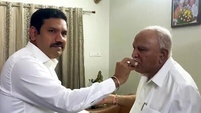 Former Karnataka chief minister and BJP leader BS Yediyurappa congratulates son BY Vijayendra Yediyurappa on Friday. (ANI) Former Karnataka chief minister and BJP leader BS Yediyurappa congratulates son BY Vijayendra Yediyurappa on Friday. (ANI)