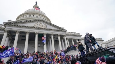 FILE - Rioters loyal to President Donald Trump stand on vehicles and the steps of the U.S. Capitol on Jan. 6, 2021, in Washington. Jason Donner, a former Fox News producer says in a lawsuit filed Monday, Nov. 13, 2023, he was targeted and fired for pushing back against false claims about the riot at the U.S. Capitol on Jan. 6. Donner said he was part of a “purge” of employees who refused to report information that would please Trump and his supporters. Donner was inside the Capitol during the riot and pressed his complaints about the networks coverage for months(AP Photo/Julio Cortez, File) (AP) FILE - Rioters loyal to President Donald Trump stand on vehicles and the steps of the U.S. Capitol on Jan. 6, 2021, in Washington. Jason Donner, a former Fox News producer says in a lawsuit filed Monday, Nov. 13, 2023, he was targeted and fired for pushing back against false claims about the riot at the U.S. Capitol on Jan. 6. Donner said he was part of a “purge” of employees who refused to report information that would please Trump and his supporters. Donner was inside the Capitol during the riot and pressed his complaints about the networks coverage for months(AP Photo/Julio Cortez, File) (AP)