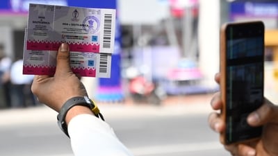 A person shows two ICC World Cup tickets of India and South Africa in front of Eden Garden in Kolkata (Samir Jana/ Hindustan Times)